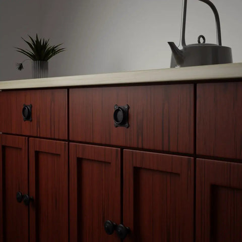 Premium Mission Style Wrought Iron Cabinet Ring Pull 2 Inch Antique Drop Handle With Matte Black Rust Resistant Powder Coat mounted on wooden cabinet.