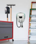 Badass Level 2 EV Charger Hard Wired With 30 Amp 240 Volt J1772 Compatibility mounted on garage wall with tools and ladder.