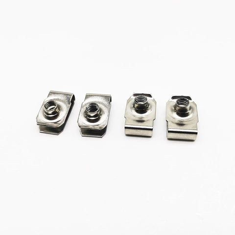 Four heavy duty stainless steel clip on U nuts for automotive body work and metal job sites in a line.