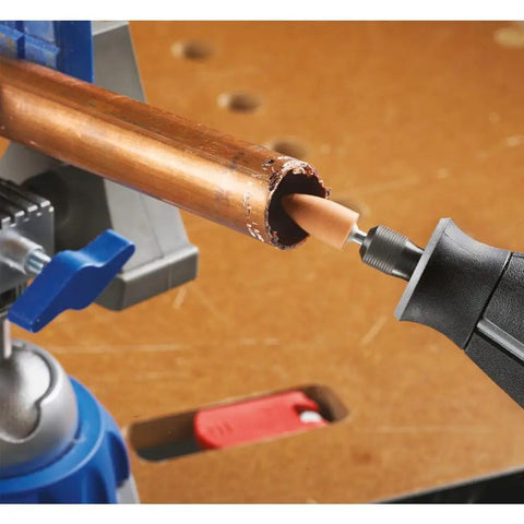 Top Shelf Rotary Tool Accessory Kit Loaded With Heavy Duty Micro Bits For Cutting Engraving Grinding Sanding And Polishing Comes With A Solid Storage Case Built For Weekend Hobby Hustle Backyard Fixes And Creative Project Grinds. Copper pipe being ground with rotary tool bit.