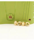 Copper Knurled Threaded Inserts M1 To M8 Heat Molded Double Twill Injection shown in green plastic part