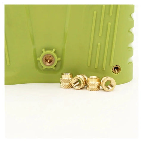 Copper Knurled Threaded Inserts M1 To M8 Heat Molded Double Twill Injection shown in green plastic part