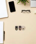 Get These Hella Sturdy Leather Cord Organizers 12 Piece Set With Secure Snap Closures To Quickly Tidy Up Charging Cables Headphones And Travel Gear For Smooth Living. Three leather cord organizers on a workspace.