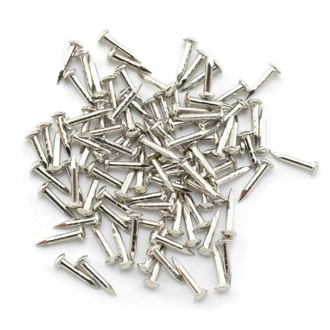 Close-up of pile of 96 nails included in Miniature Brass Hinges Set For Jewelry Boxes And Cabinets 24 Pieces 10 By 8 Millimeter 180 Degree Rotation Silver Finish Includes 96 Mounting Nails Durable Rust Resistant Hardware For DIY Projects Easy To Install