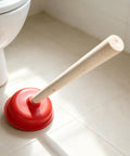 Rock Solid Heavy Duty Rubber Cup Toilet Plunger With Reinforced Wooden Handle resting on tile floor, ready to clear clogs.