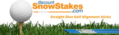 Golf ball on tee with grass and blue Straight Shot Golf Alignment Sticks, logo of discountSnowStakes.com visible.