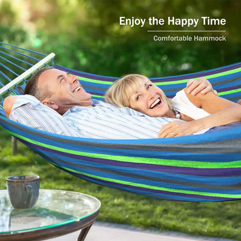 Couple relaxing in Portable Camping Hammock With Upgraded 320G Canvas Fabric For Super Comfy Relaxation 550Lb Weight Capacity