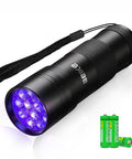Tiny But Mighty Portable UV Black Light Flashlight With 12 LEDs shown with batteries and wrist strap