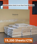 Heavy Duty 6X6 Inch Pre Cut Parchment Paper Squares 19200 Ct Bulk Case Oven Safe stacked in a dust-free workshop setting.