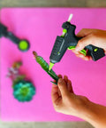 Using High Temperature Mini Hot Glue Gun With Fine Tip For Detailed Crafting And DIY Projects on a small succulent plant