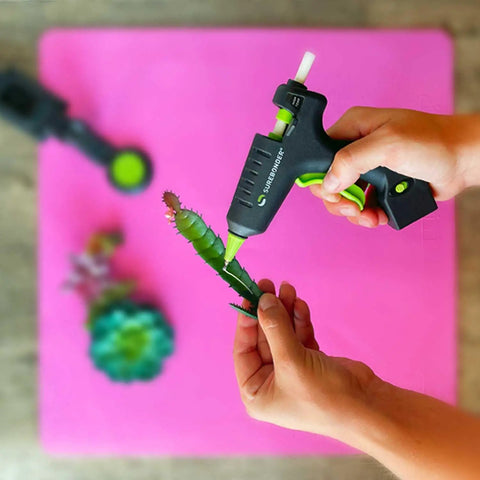Using High Temperature Mini Hot Glue Gun With Fine Tip For Detailed Crafting And DIY Projects on a small succulent plant