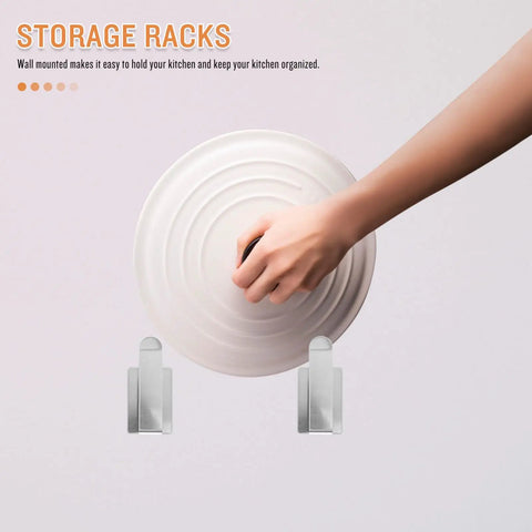 Hand placing lid on stainless steel wall mounted lid rack and cutting board holder for pan lids, moisture resistant.