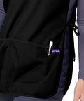 Close-up of Unisex Cobbler Aprons 3 Pack Black Durable Work Apron With Deep Front Pockets Self Trim Binding over a shirt.