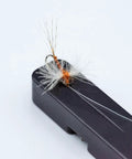 Fly lure on Mag Grab Rod Rack Magnetic Fishing Rod Holder Black Quick-Access One-Hand Mount for easy lure changes.