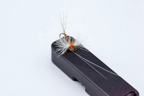 Fly lure on Mag Grab Rod Rack Magnetic Fishing Rod Holder Black Quick-Access One-Hand Mount for easy lure changes.