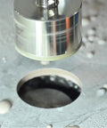Heavy Duty Quarter Inch Diamond Hole Saw Two Piece Kit Brazed Premium Grain Design cutting through concrete surface.