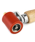 Close-up view of Silicone Seam Roller High Temperature Resistant Heavy Duty Pro Grade Hand Pressure Roller with wood handle and red silicone wheel.