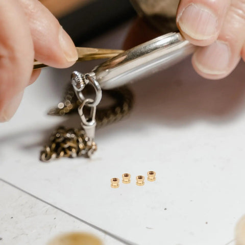 Sixty Piece Heavy Duty Copper Thread Inserts With Knurled Nuts To Keep Pcb Boards And Electronic Panels Rock Solid Featuring Reliable Female Threads Built Tough For Long Term Professional Builds, shown in use with a circuit panel.