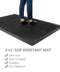 Heavy Duty Rubber Floor Mat With Drainage Holes 24 By 36 Inches Anti Fatigue Non Slip Indoor Outdoor Drain Mat in use with feet standing on it
