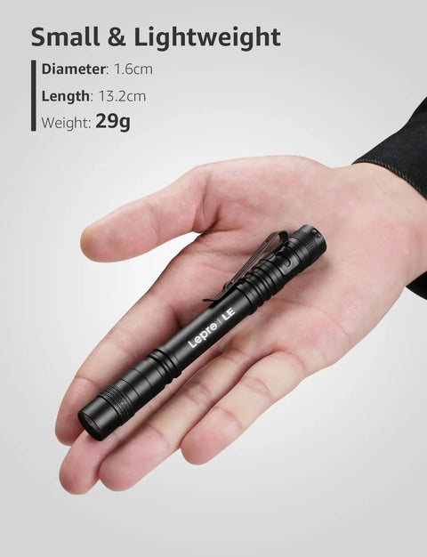 Hand holding Ultra Bright LED Pen Flashlights Mini Pocket Lights With Clip 2 Pack Waterproof For Inspection, Work, And Emergency Use