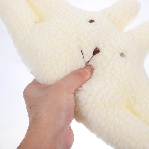 Hand holding a fluffy white door stopper for home and office soft durable wall protector that prevents finger pinching noise free door guard
