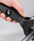 Close-up of hand using Ratcheting Tubing Cutter 2-In-1 Close Quarters Pipe Cutter For Copper PVC And Metal Tubes Cuts From 5/16 To 1-1/8 Inch