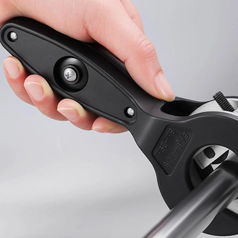Close-up of hand using Ratcheting Tubing Cutter 2-In-1 Close Quarters Pipe Cutter For Copper PVC And Metal Tubes Cuts From 5/16 To 1-1/8 Inch
