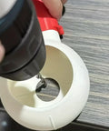 Drill Dust Collection Box With Rotating Tilt Nozzle in use, capturing dust at source from a drill bit, red and white attachment.