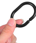 Hand holding black plastic C shaped shower curtain hook, part of Plastic C Shaped Shower Curtain Hooks Set Of 24 For Easy Glide In The Bathroom