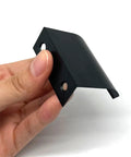 Hand holding Six Pack 50Mm Drawer Pulls Matte Black Aluminum Cabinet Handles, showing sleek modern edge design and hidden mounting.