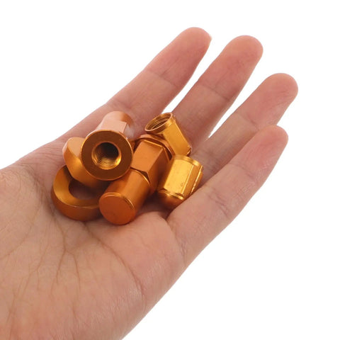 Aluminum Motorcycle Valve Stem Lock Nut Spacer Kit With High Strength Bolts And Washers, Vibration Resistant Leak Prevention Secure Tire Seal Replacement Set Compatible With Multiple Motorcycles, orange aluminum parts in hand
