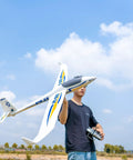 Person holding 2000mm SZD-54 6 Channel RC Plane PNP Kit With Propeller Remote Control Airplane White Finish against blue sky