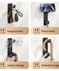 Image showing Four Five Pack Heavy Duty Adhesive Wall Hooks That Hold Up To 22 Lbs No Drill Install Easy On Clean Removal Sleek Black Finish For Kitchen Bathroom And Beyond Perfect For Towel Racks Utensils And More used as keychain hook, phone stand, jewelry, and umbrella storage