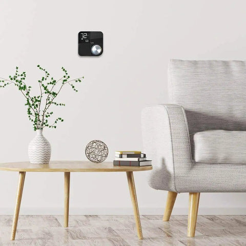 Living room with Smart Wifi Thermostat With Alexa And HomeKit Geofencing Capable Works With Google Assistant on wall