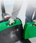 Maneuver Heavy Loads With This Smooth Full Electric Pallet Jack Truck, showcasing green lithium battery being handled.