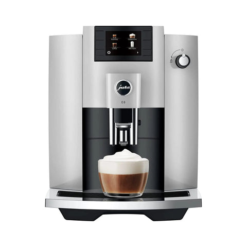 Premium Automatic Espresso Machine In Sleek Platinum Finish with milk froth ready in a glass, showcasing one touch brewing features.