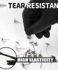 A hand wearing Heavy Duty 3.5 Mil Nitrile Disposable Gloves In Bold Black picks up a metal fastener, showcasing tear resistance.
