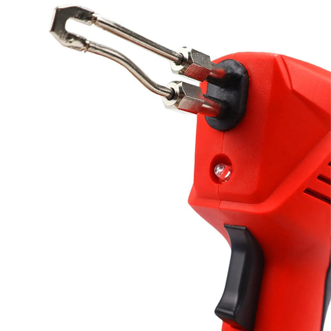 Close-up of Instant Heat Pro Grade Soldering Gun Kit 120V AC With 700F Max Temp Trigger Activated And Built In Work Light, showing soldering tips.