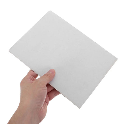 Hand holding a sheet from 20pcs White Corrugated Cardboard Sheets 8x6 Inches 1.5mm Thick Shockproof Packing Inserts For Mailing