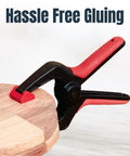 10 Pack Mini Spring Clamps With 1 Inch Opening And Pivoting Jaw Pad EZ Grip Plastic Clips securing wood piece