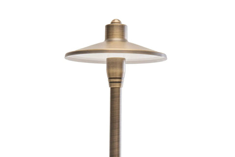 Close-up of G2 12V Brass Path Light from 4 Pack Kit with 3W 2700K Warm White G4 LED Bulbs for outdoor pathways and gardens.