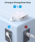 Two Prong Power Strip With 10Ft Cord And 1440J Surge Protector Turns One Old Two Hole Outlet Into Four 3 Prong Outlets And Four USB Ports Wall Mount White displayed with cords plugged in.