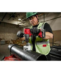 Rugged 18V Brushless Cordless Drill Driver with 1/2 Inch Metal Chuck Featuring Auto Stop and Compact Side Handle in use on metal pipe
