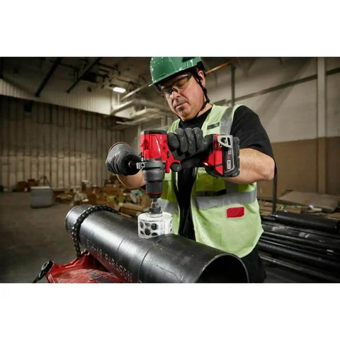 Rugged 18V Brushless Cordless Drill Driver with 1/2 Inch Metal Chuck Featuring Auto Stop and Compact Side Handle in use on metal pipe