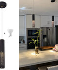 Must-Have Modern Sand Black Cylinder Pendant Light For Kitchen Island And Dining Room, shown over kitchen island