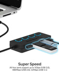 Four Port Powered USB 3.0 Hub With Individual LED Power Switches For Independent On Off Control Supports Up To 5Gbps High Speed Data Transfer Plug And Play Easy Expansion For Desktops Laptops And Notebooks, black USB hub with four glowing ports connected to laptop