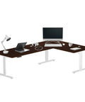 Hella Roomy Electric Height Adjustable Standing Desk L Shaped Corner Computer Workstation 83x55 Inches Giant Platform with roasted walnut finish.