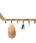 Top Shelf Hockey Stick Coat Rack Featuring Six Rock Solid Hooks Ideal For Dropping Your Jackets Hats And Gear Quick Wall Mounted Storage Piece That Saves Floor Space And Keeps Your Entryway Clean, displaying cap, keys, and hook.