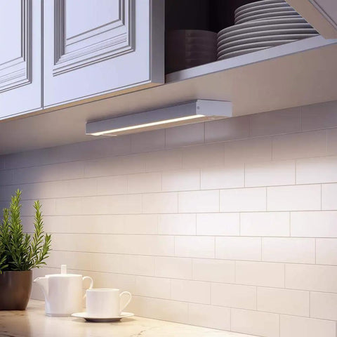 Slim 9 Inch LED Under Cabinet Light Direct Wire, 3000K Warm White, 6W, installed under kitchen cabinet with white backsplash