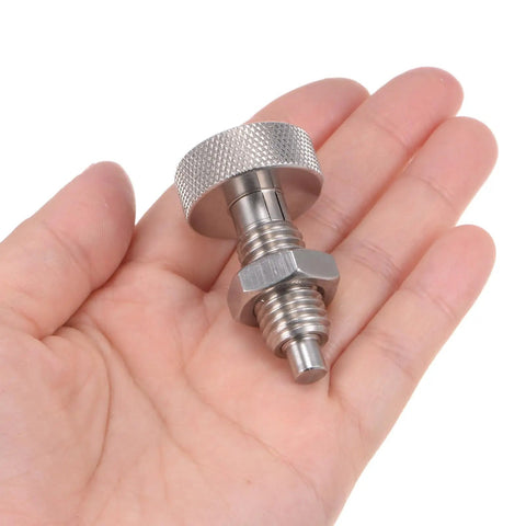 Rock Solid Stainless Steel Spring Plunger With Knurled Grip Handle M12X1.75 Thread And 6mm Pin in a hand, showcasing its compact size and design.